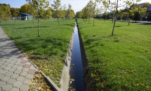 Drain drain for water. Autumn in the park. Park in a small village. Autumn colors.